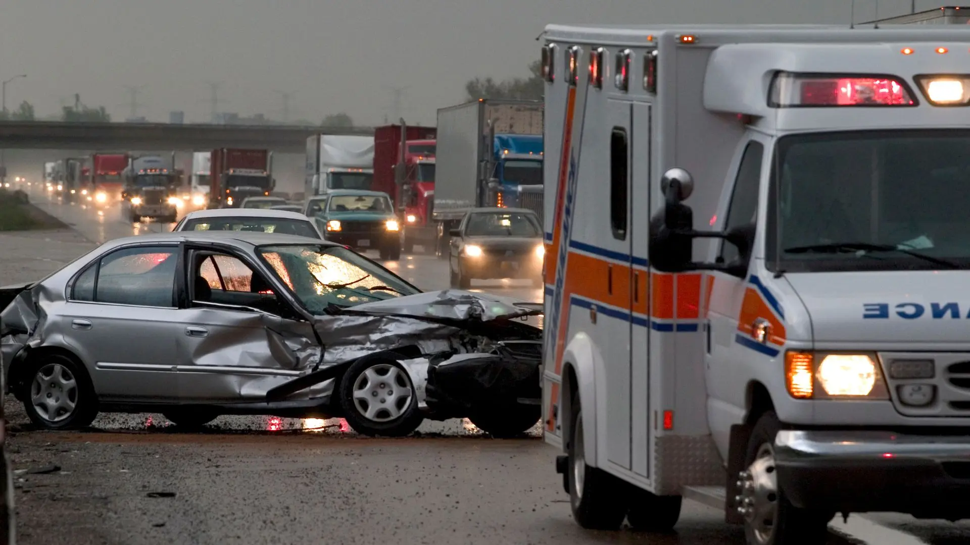 An image of an ambulance and car accident.