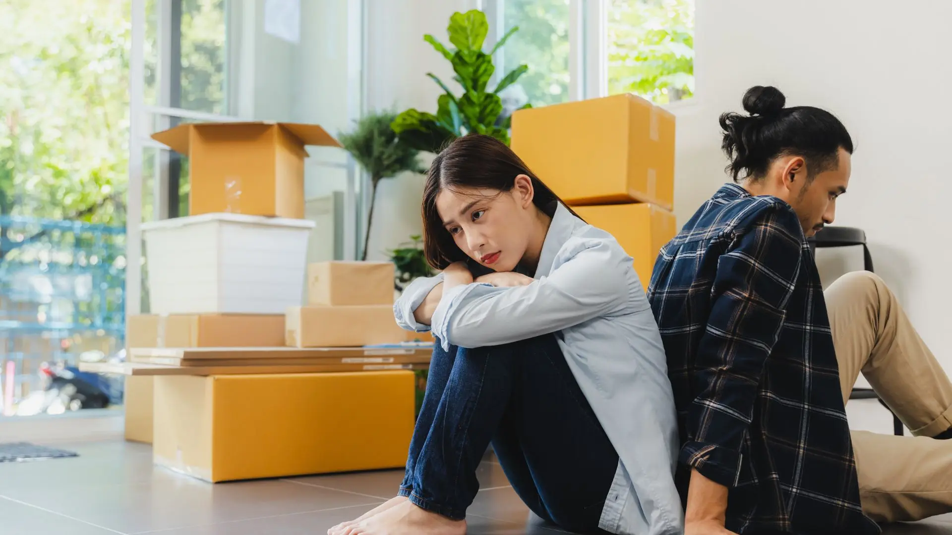 An image of an unhappy couple dividing their marital property.