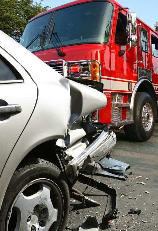 An image of a ambulance and firetruck at the scene of an accident that illustrates the personal injury services at Georgai Family Matters Law.